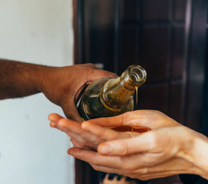 Close-up of man holding cigarette