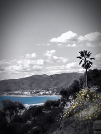 Scenic view of mountains against cloudy sky