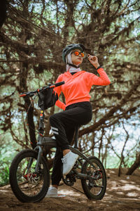 Portrait of young woman riding bicycle