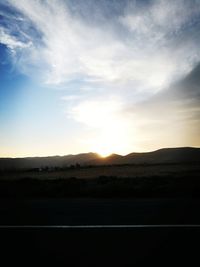 Scenic view of landscape against sky during sunset