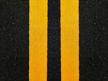 High angle view of yellow lines on road