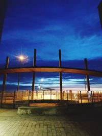 Bridge over sea against sky at dusk