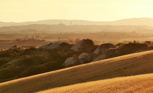 Scenic view of landscape and mountains against sky