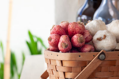 Close-up of fruits in basket on table