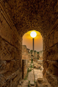 Illuminated historic building against sky