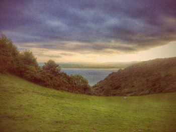 Scenic view of landscape against cloudy sky