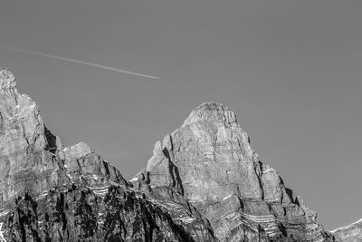 Low angle view of rock formation against sky