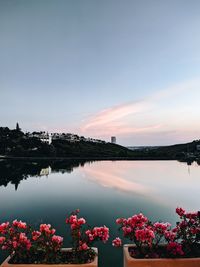 Scenic view of lake against sky during sunset