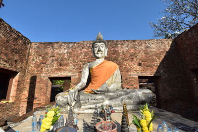 Low angle view of statue against sky