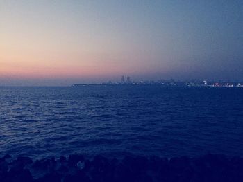 Scenic view of sea against sky at sunset