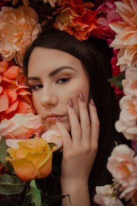 Close-up of woman with red roses