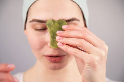 Midsection of woman holding plant