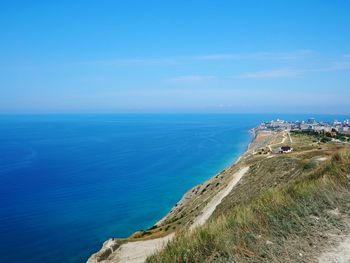 Scenic view of sea against blue sky