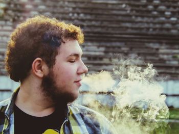 Young man smoking cigarette