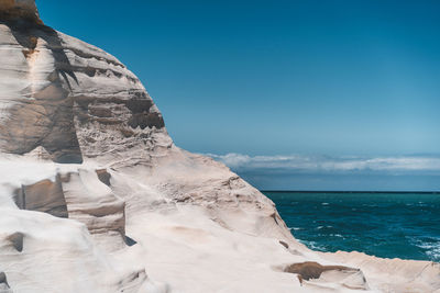 Scenic view of sea against clear blue sky