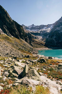 Scenic view of lake and mountains against sky