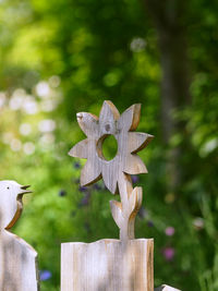 Close-up of sculpture on wooden post