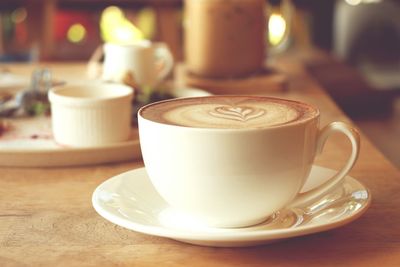 Close-up of coffee cup on table