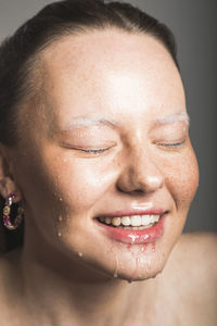 Close-up portrait of a smiling young woman