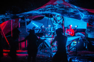 Group of people dancing at night