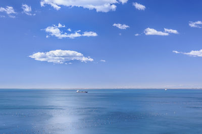 Scenic view of sea against cloudy sky