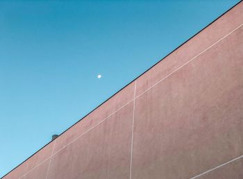 Low angle view of building against blue sky