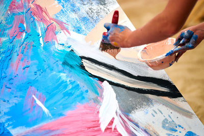 Drip painting expression art on canvas with blue, pink colors, art performance