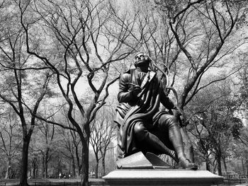 Low angle view of statue against sky