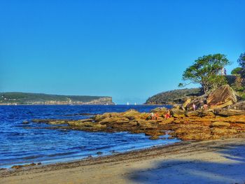 Scenic view of sea landscape against clear sky