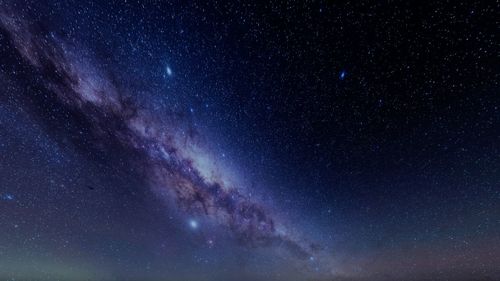 Low angle view of stars in sky at night