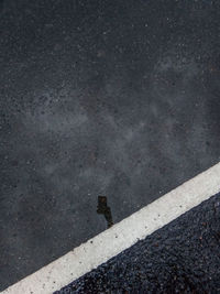 High angle view of road sign on street