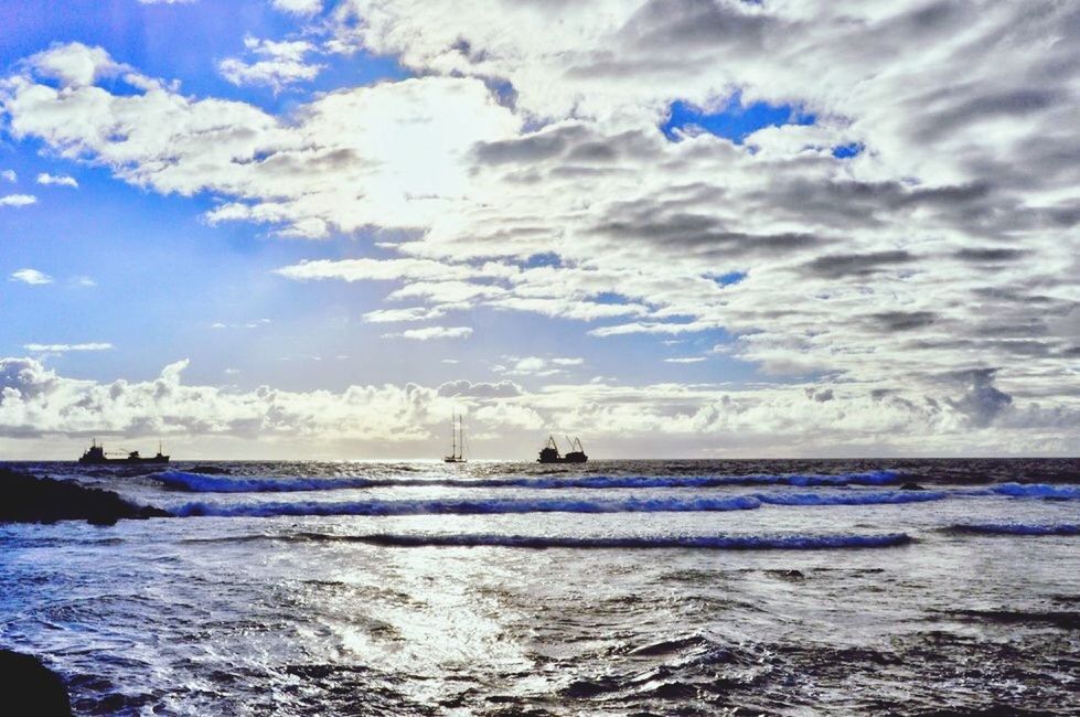 water, cloud - sky, sky, sea, beauty in nature, scenics - nature, horizon, nature, motion, wave, horizon over water, day, nautical vessel, beach, land, no people, waterfront, blue, outdoors, power in nature