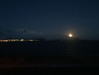 Scenic view of sea against sky at night