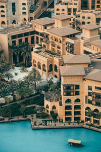 View of swimming pool by buildings