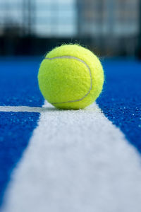 Close-up of tennis ball on playing field
