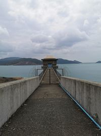 Pier over sea against sky