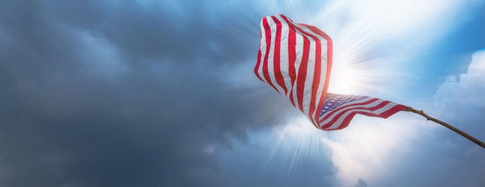 Low angle view of flag against sky