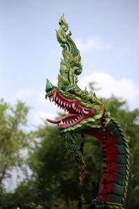 Low angle view of statue against sky