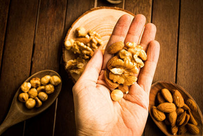 Nuts and almonds on a wooden table 