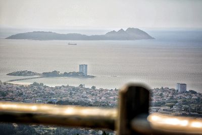 View of cityscape against cloudy sky