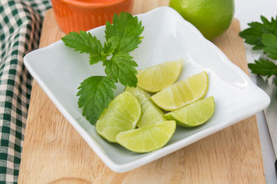 High angle view of fruits in plate on table