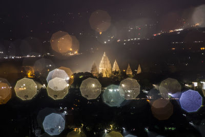 View of illuminated buildings in city at night