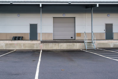 Empty parking lot against sky in city