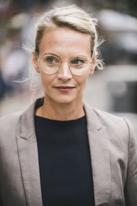 Blond businesswoman wearing eyeglasses