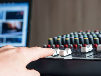 Close-up of man playing sound mixer