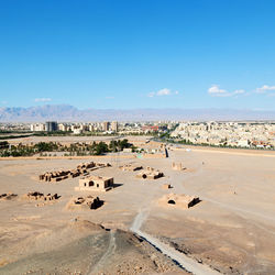 Scenic view of desert against blue sky