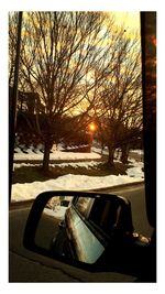 Snow covered landscape at sunset