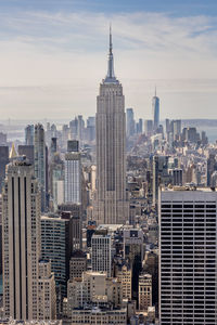 Modern buildings in city against sky