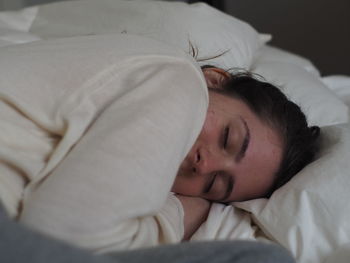 Portrait of baby sleeping in bed