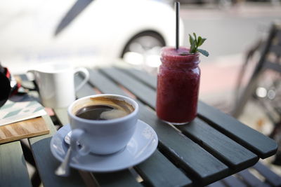 Close-up of coffee served on table at cafe